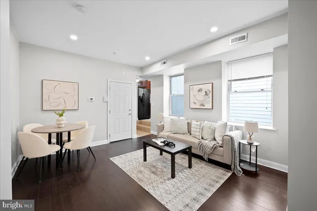 a kitchen with stainless steel appliances granite countertop a stove microwave and sink