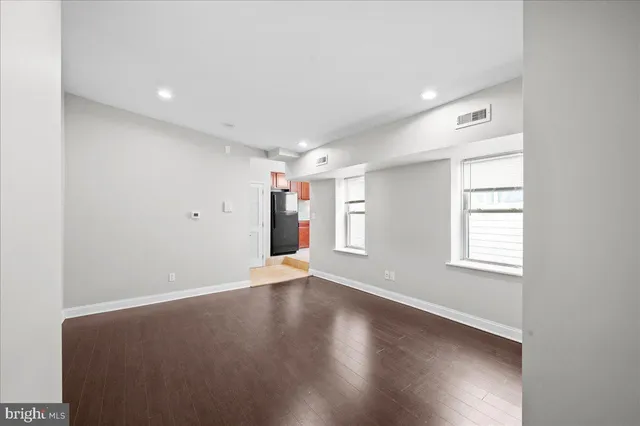 a kitchen with stainless steel appliances granite countertop a refrigerator stove a sink and a microwave