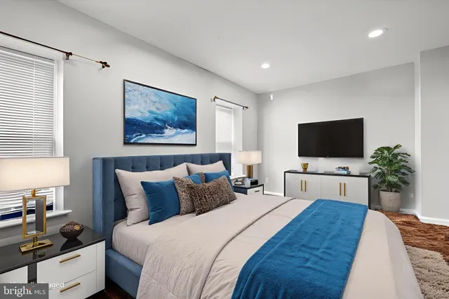 a bathroom with a sink toilet bathtub and vanity