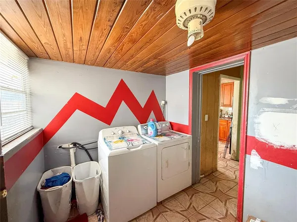 a room that has a rug and tent in it