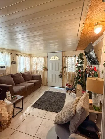 a living room with furniture and a rug