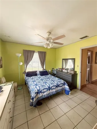a bedroom with a bed and a dresser