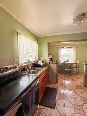 a kitchen with lots of counter top space and dining table view