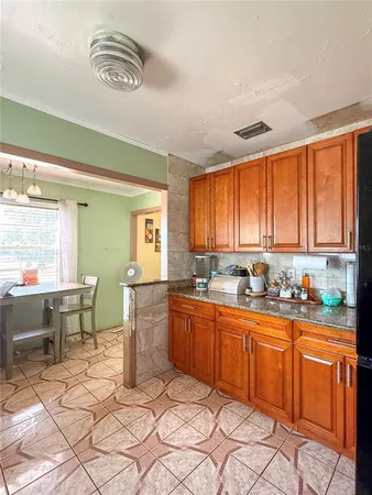 a kitchen with a sink cabinets and window