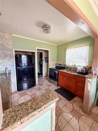 a room with granite countertop lots of counter top space
