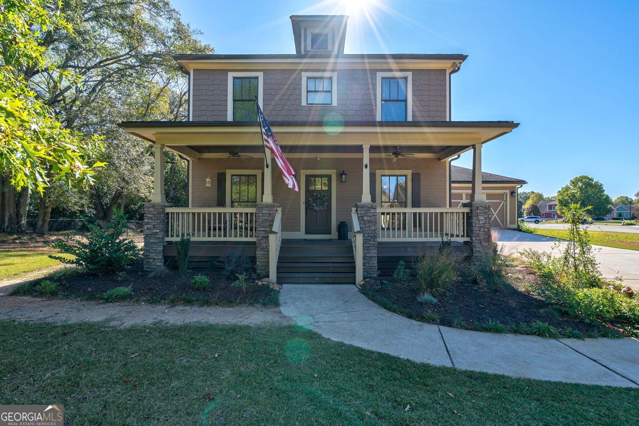 a front view of house with yard and green space