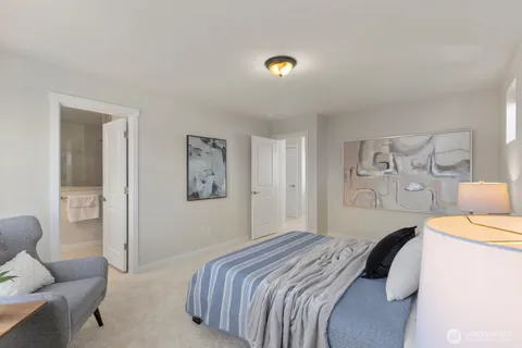a bedroom with a bed and a couch