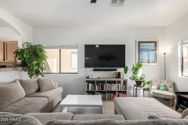 a living room with furniture and a flat screen tv