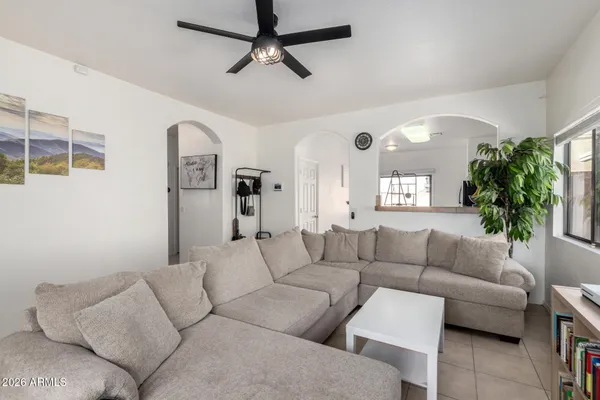 a living room with furniture and a large window