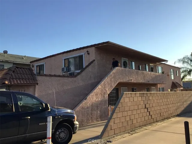 a front view of a house with parking space