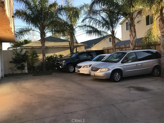 a view of a car parked in front of a house