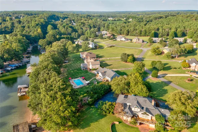 a view of a dining room with furniture wooden floor and chandelier