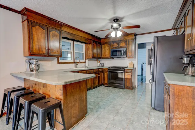 a room with wooden shelves and a book shelf