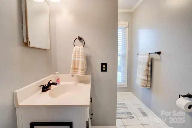 a bed room with a bed a desk and a window