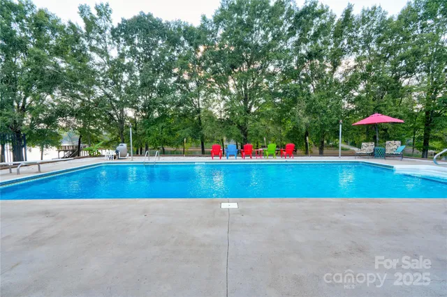 a view of pool and outdoor seating