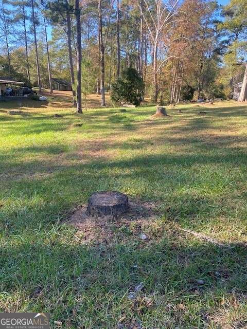 0 Woodland Court Union Point, GA 30669 - Photo 14 of 15 a backyard of apartments with large trees