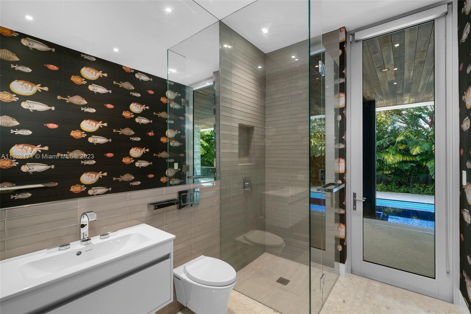 390 Pacific Road Key Biscayne, FL 33149 - Photo 24 of 37 a bathroom with a sink toilet and shower