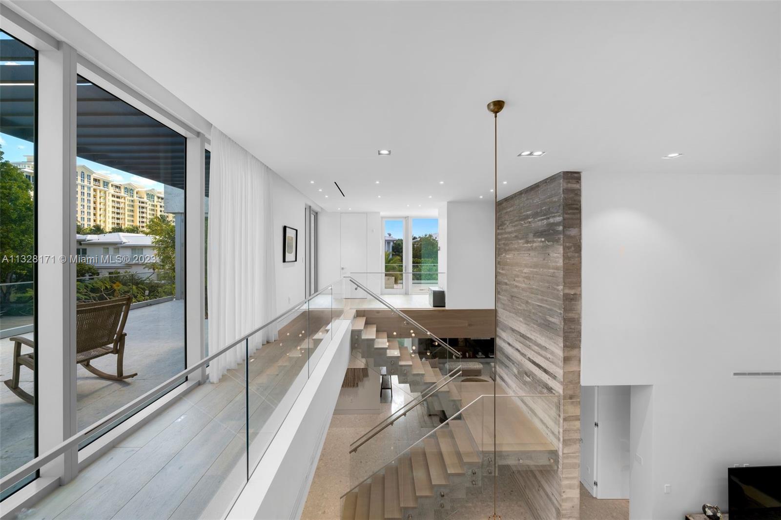 390 Pacific Road Key Biscayne, FL 33149 - Photo 32 of 37 a view of a living room and furniture