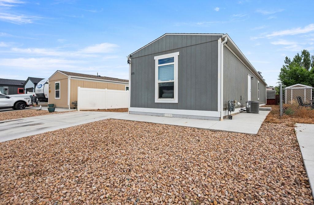 271 Clements Way Fruita, CO 81521 - Photo 24 of 26 a front view of a house with a yard