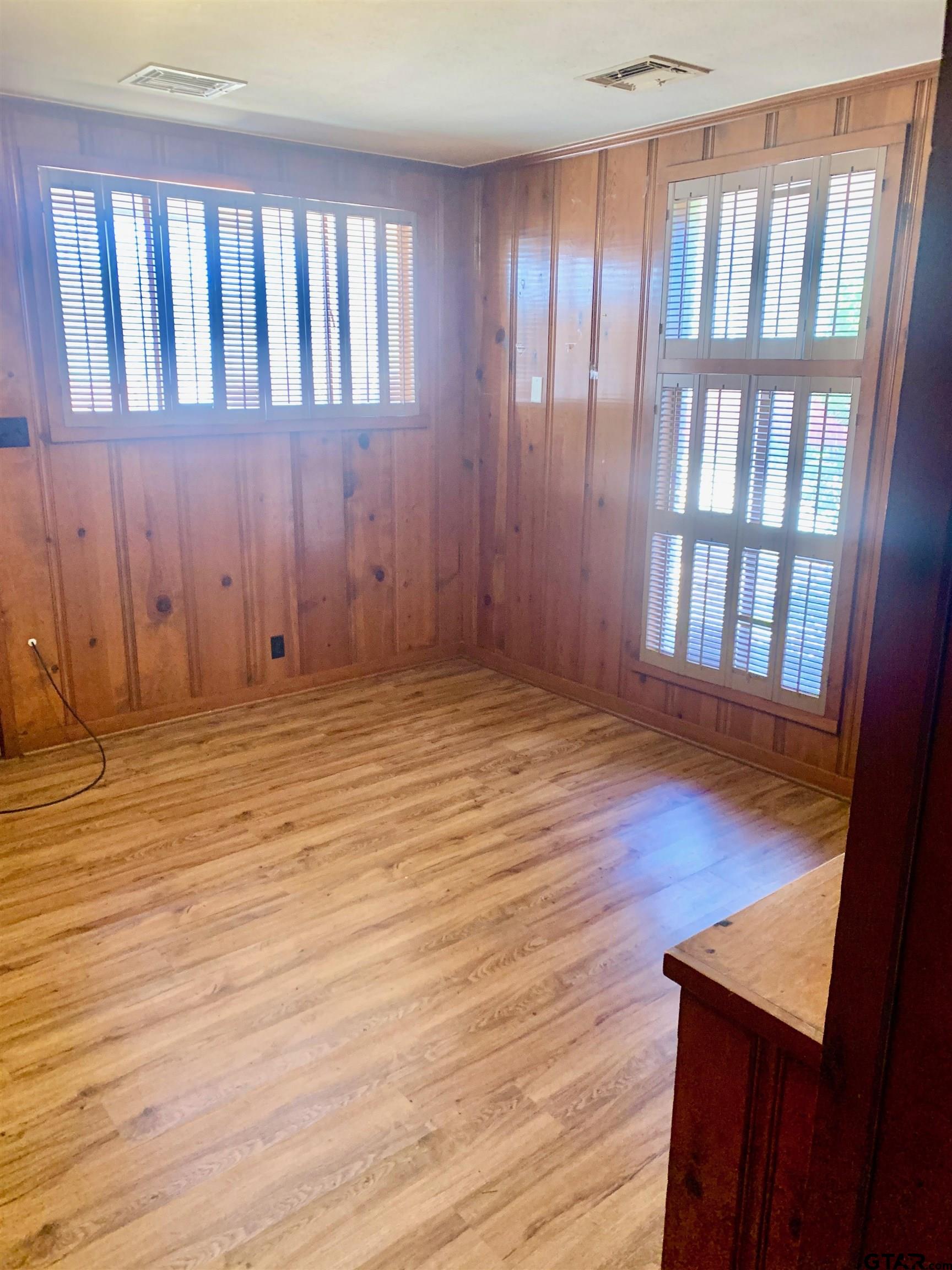 829 East Goode Street Quitman, TX 75783 - Photo 12 of 20 a view of wooden floor and staircase