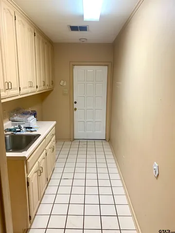 a bathroom with a sink a vanity and a window