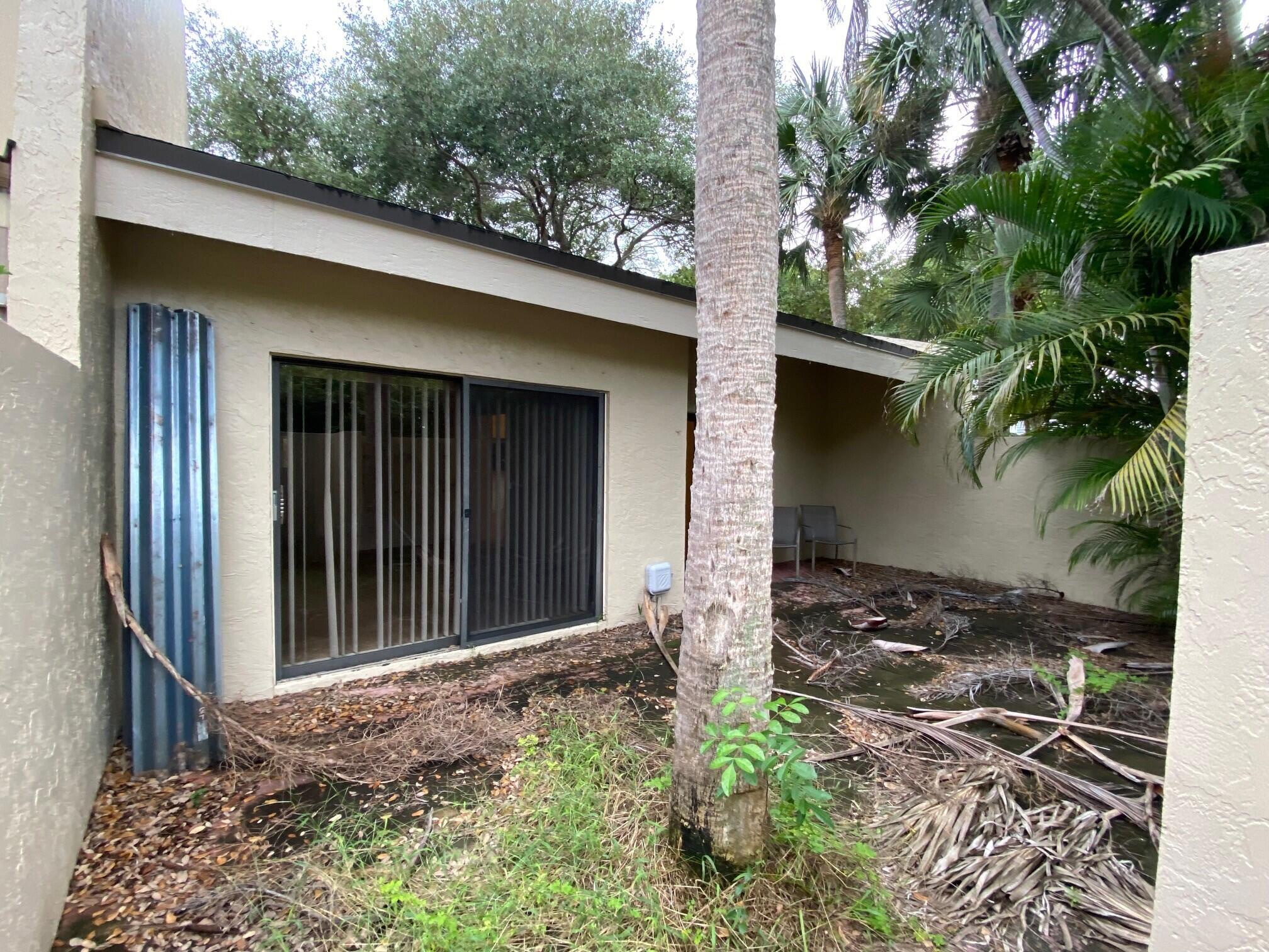 1400 Northwest 9th Avenue, Unit B8 Boca Raton, FL 33486 - Photo 25 of 26 Rear courtyard 2