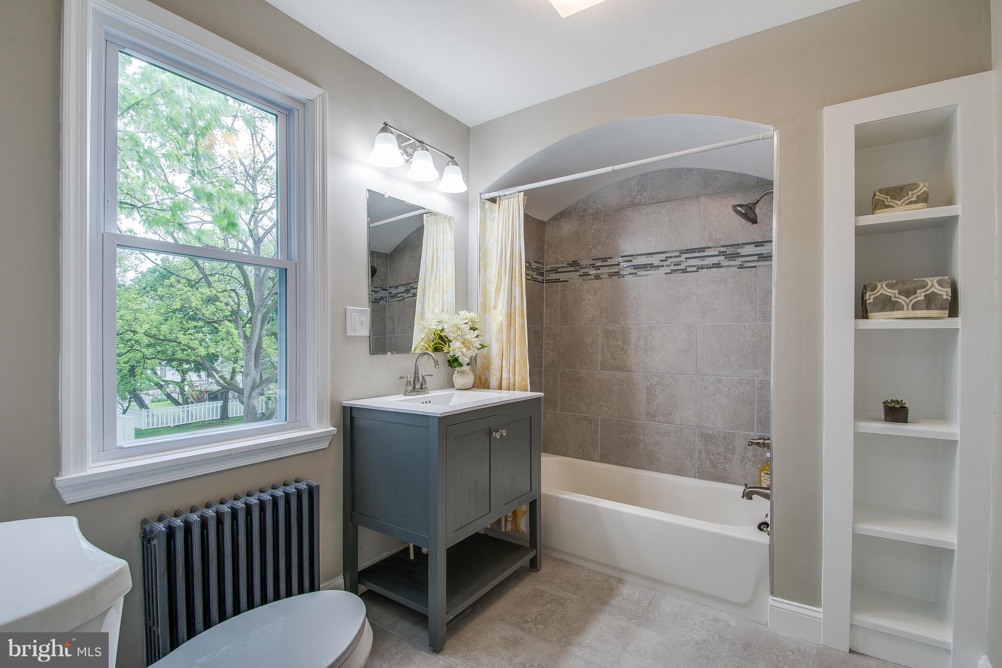 7827 Oakleigh Road Baltimore, MD 21234 - Photo 14 of 28 a bathroom with a sink toilet and shower