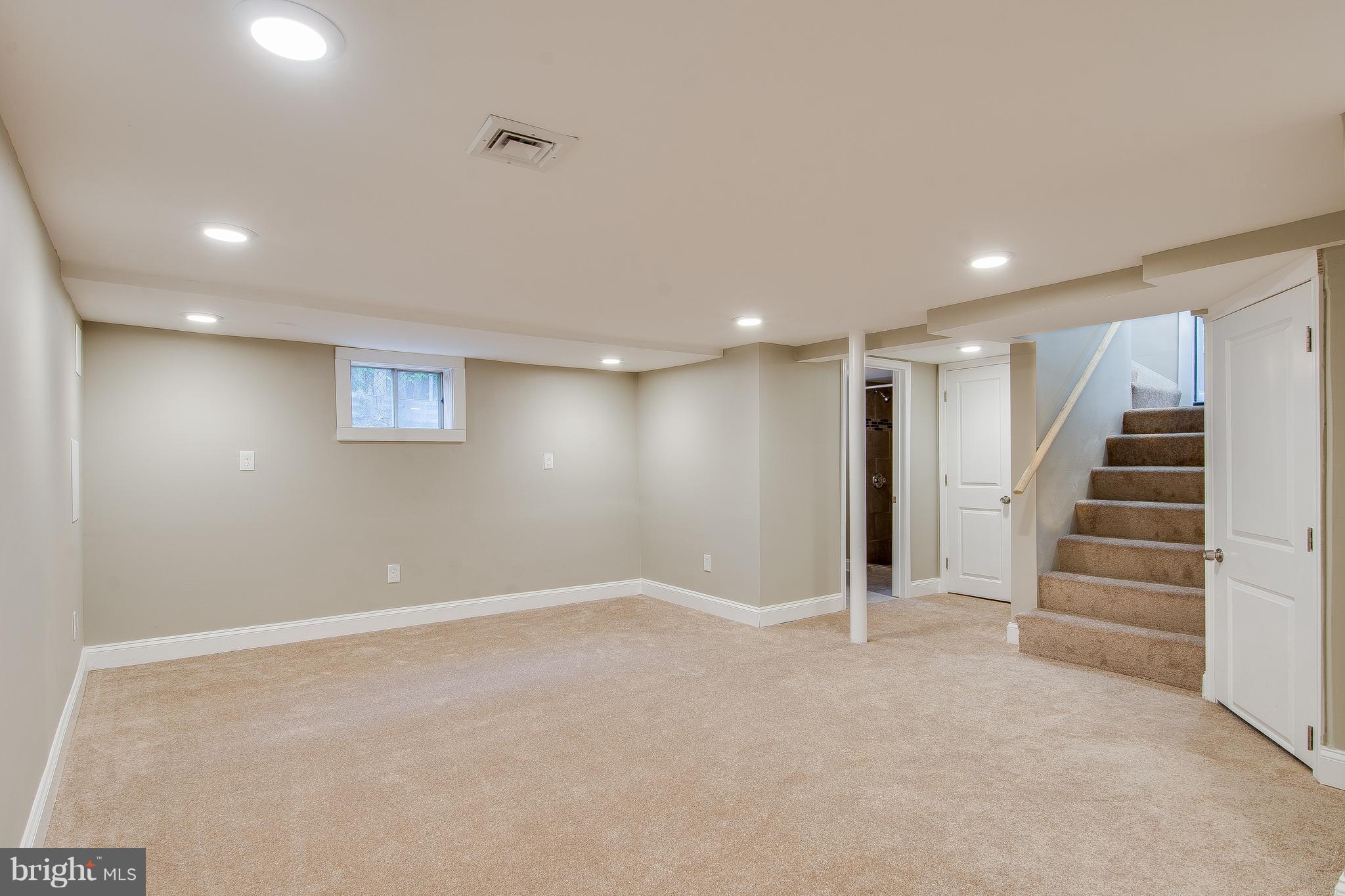 7827 Oakleigh Road Baltimore, MD 21234 - Photo 22 of 28 a view of an empty room with stairs