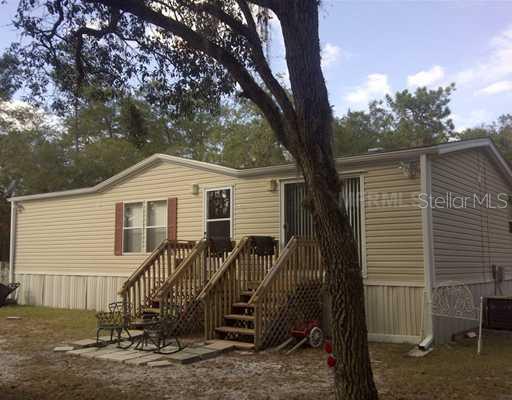 7045 Southwest 146th Ln Road Ocala, FL 34473 - Photo 1 of 1 Exterior Front