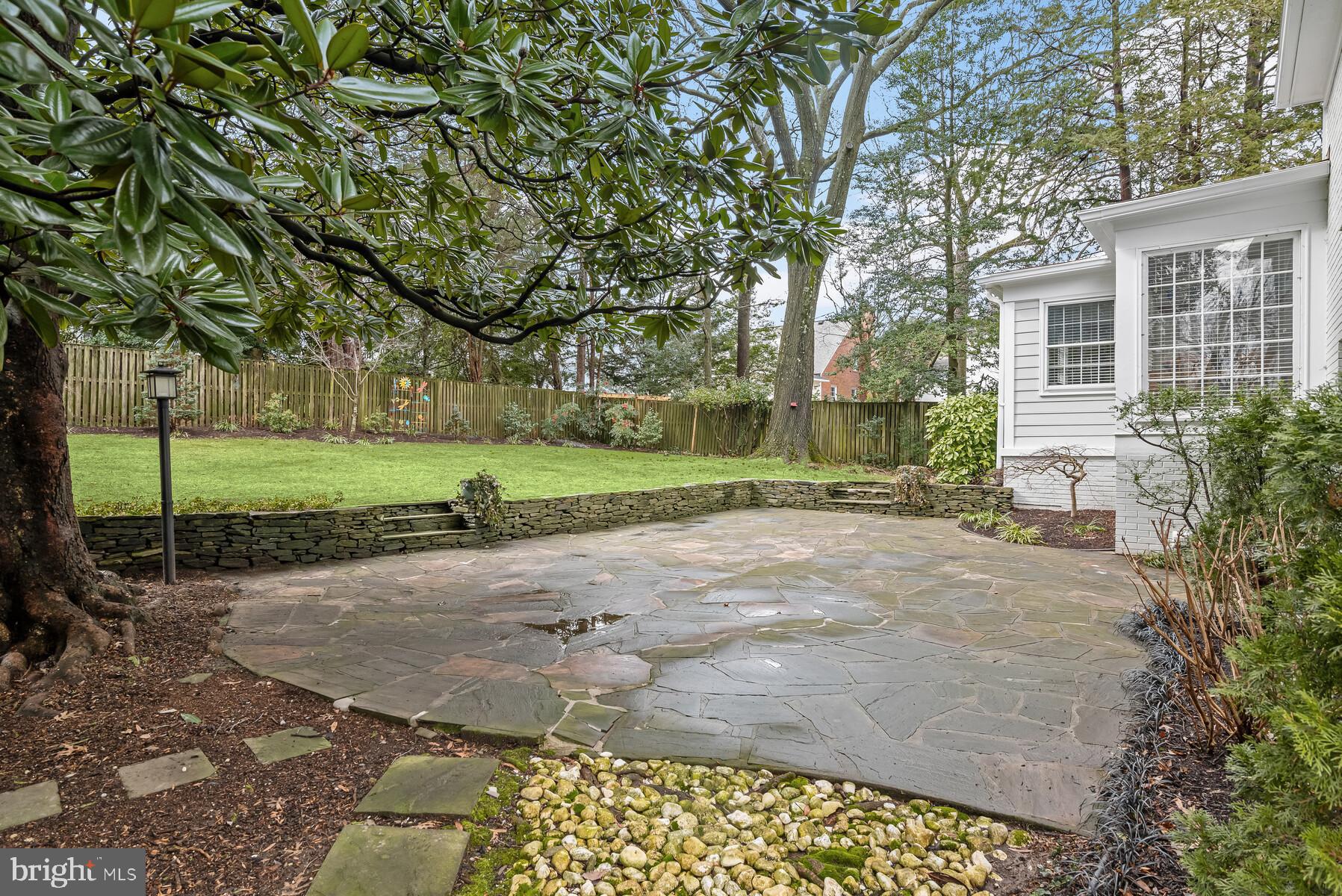 5512 Ridgefield Road Bethesda, MD 20816 - Photo 4 of 69 An hue flagstone patio w/ an astounding magnolia