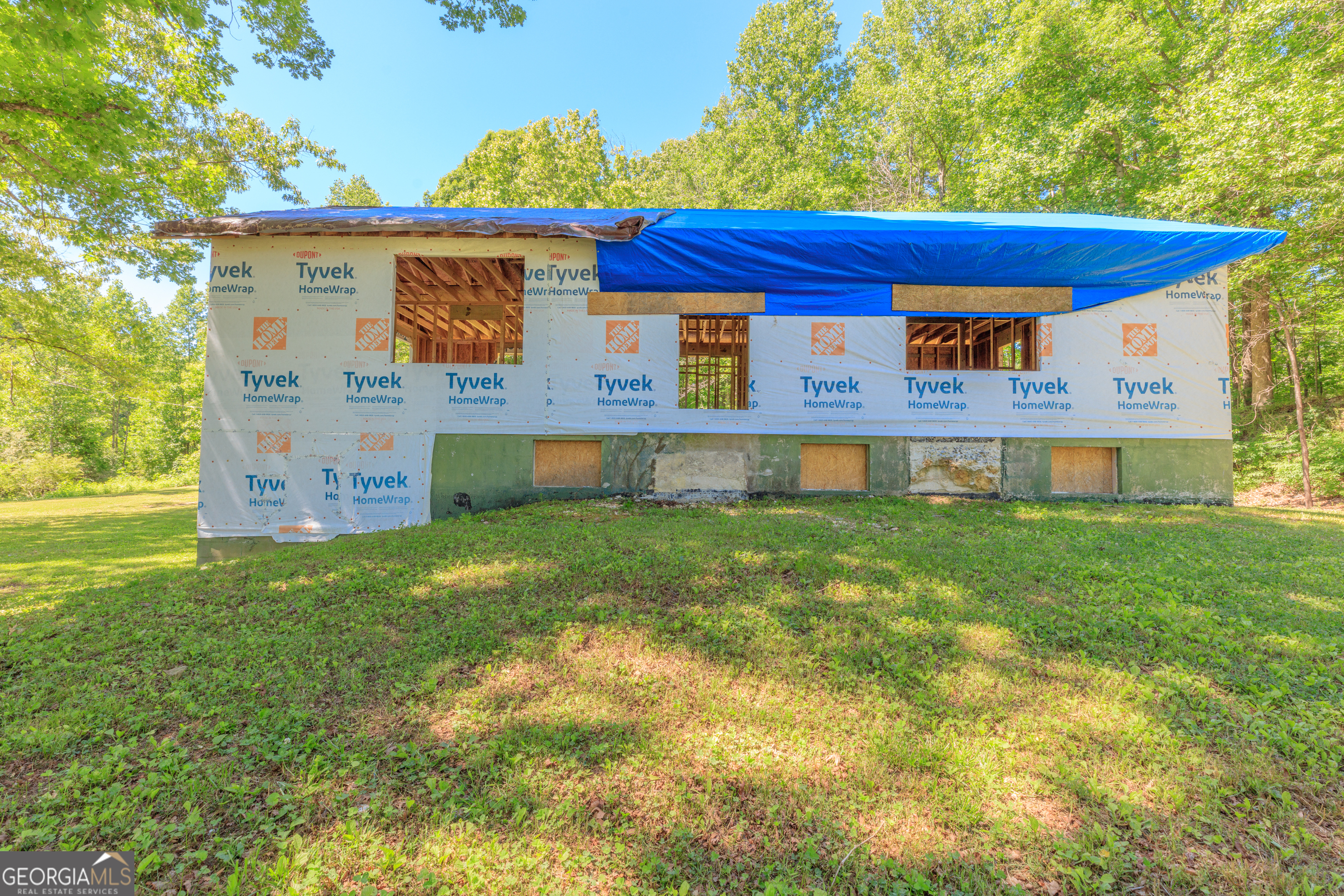 1004 Crow Gap Road Chickamauga, GA 30707 - Photo 11 of 36 a front view of a house with garden