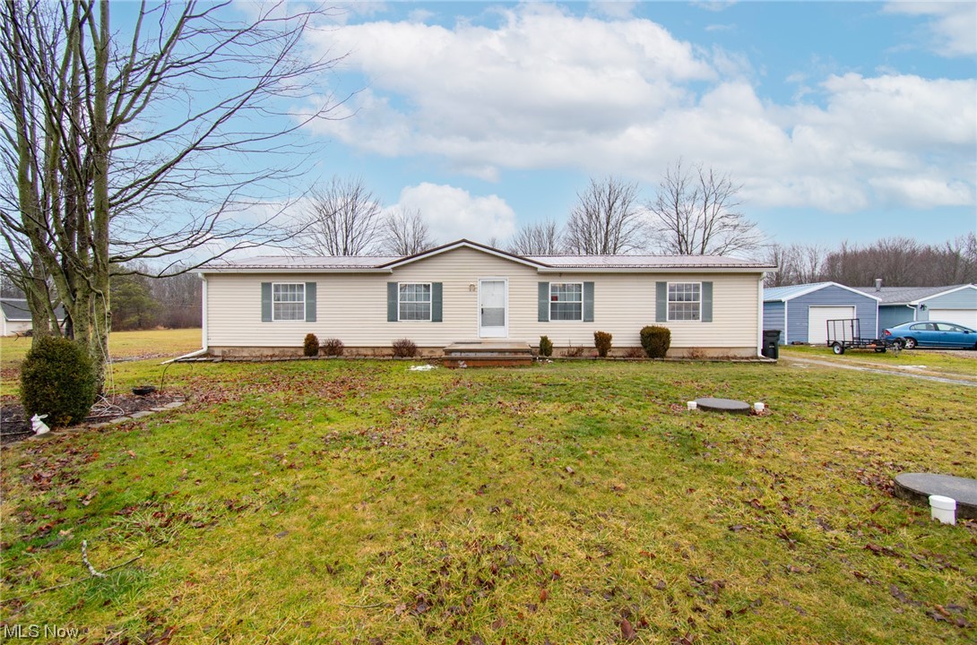 10135 Williams Road Diamond, OH 44412 - Photo 1 of 30 View of front of home with an outdoor structure, a garage, and a front yard