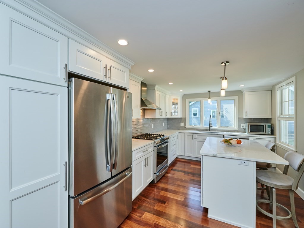 14 Hanson Street Wakefield, MA 01880 - Photo 14 of 32 a kitchen with stainless steel appliances a refrigerator stove and microwave