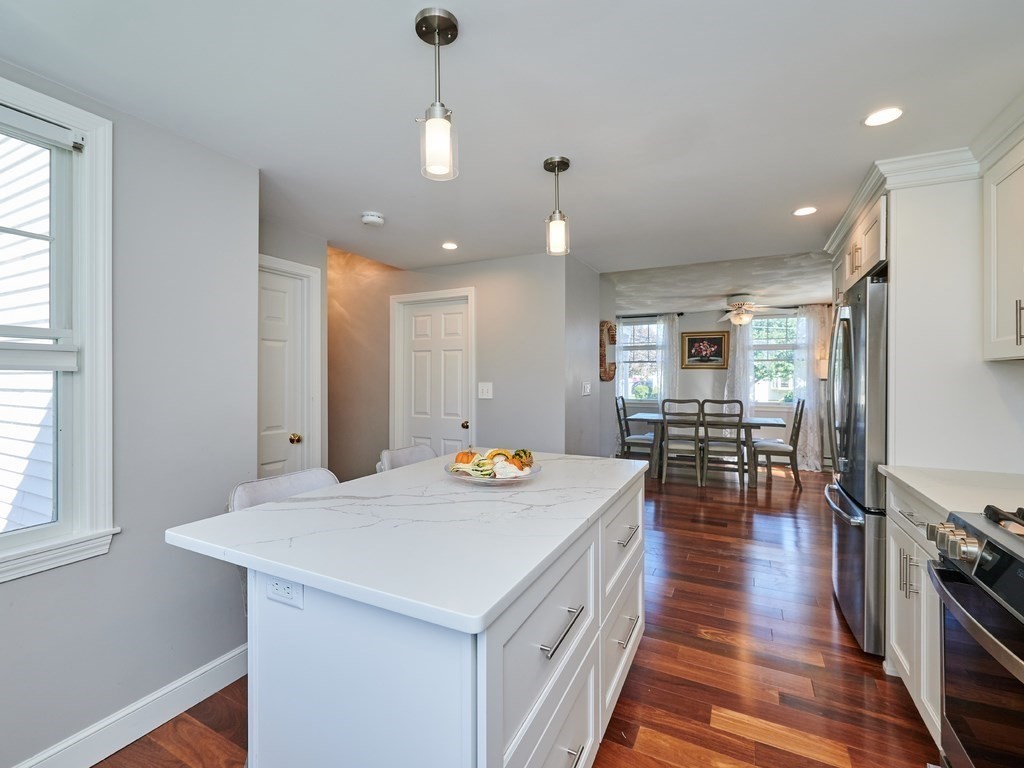 14 Hanson Street Wakefield, MA 01880 - Photo 15 of 32 a kitchen that has a table and chairs in it