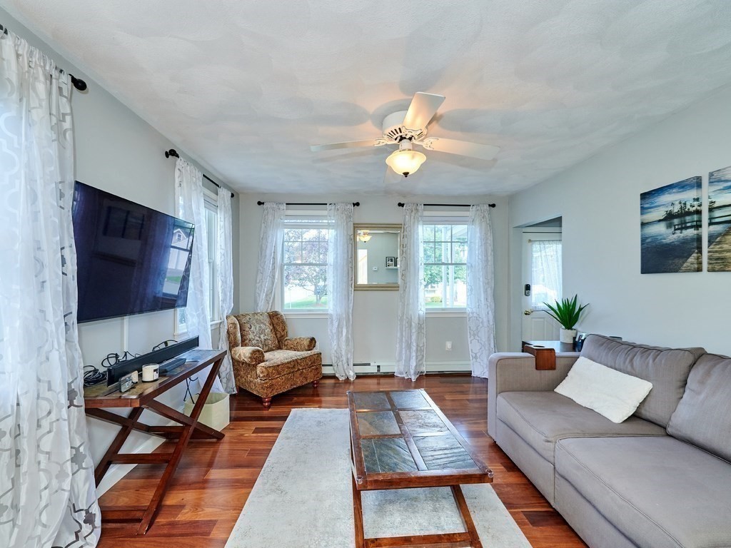 14 Hanson Street Wakefield, MA 01880 - Photo 16 of 32 a living room with furniture ceiling fan and a flat screen tv