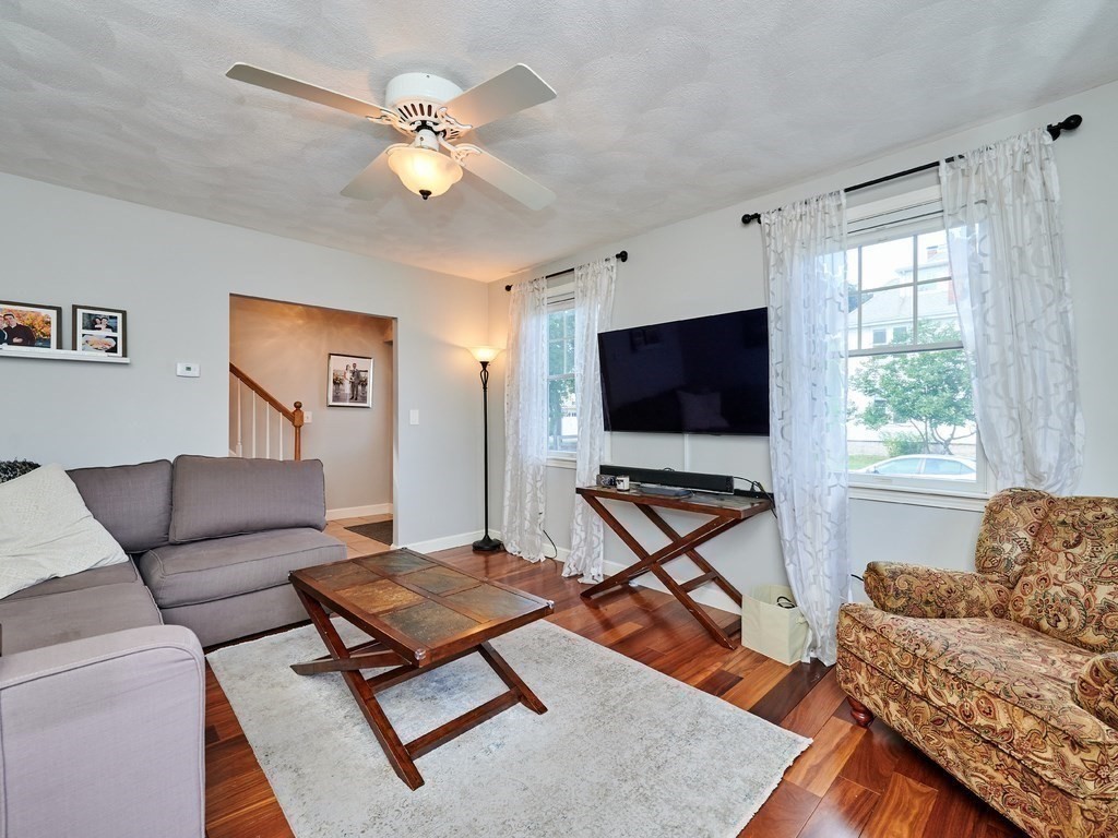 14 Hanson Street Wakefield, MA 01880 - Photo 17 of 32 a living room with furniture and a flat screen tv