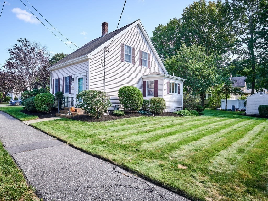 14 Hanson Street Wakefield, MA 01880 - Photo 2 of 32 a front view of house with yard and green space