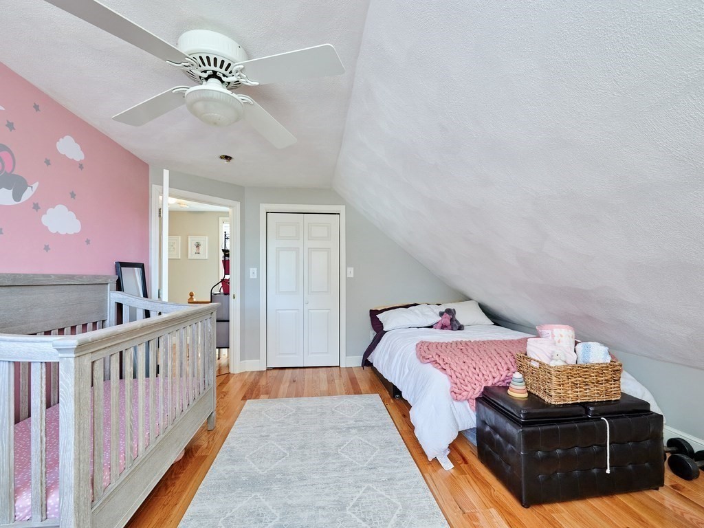 14 Hanson Street Wakefield, MA 01880 - Photo 25 of 32 a bedroom with furniture and wooden floor