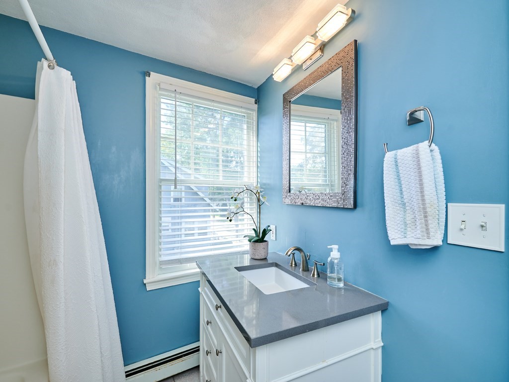 14 Hanson Street Wakefield, MA 01880 - Photo 28 of 32 a bathroom with a sink vanity and a mirror