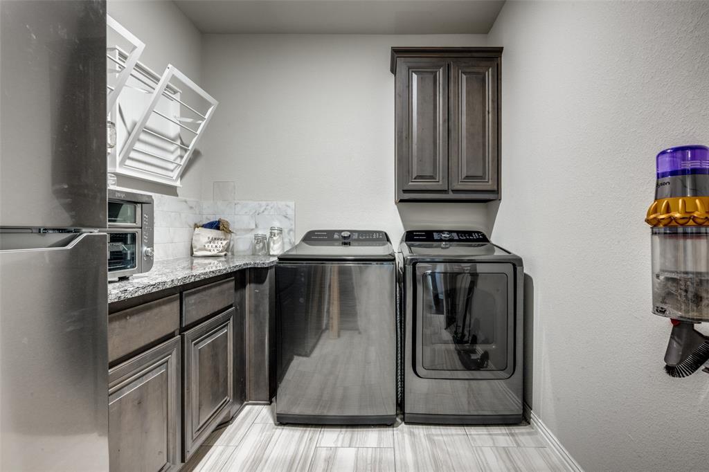 7417 Green Mesa Road Ponder, TX 76259 - Photo 29 of 39 a kitchen with granite countertop a refrigerator stove and sink