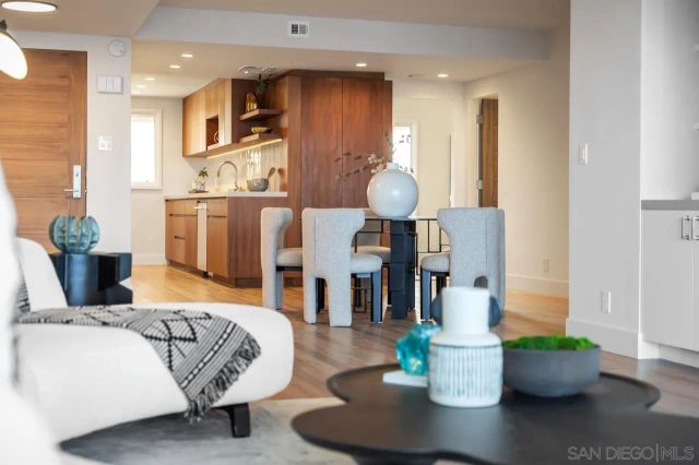 a living room with furniture and a potted plant