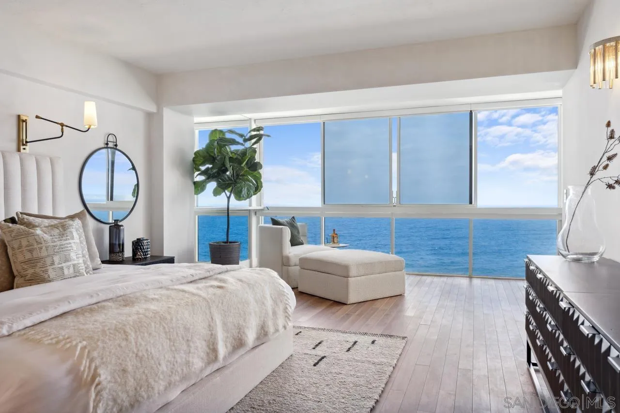 939 Coast Boulevard, Unit 12C La Jolla, CA 92037 - Photo 27 of 41 a bedroom with bed and a large mirror