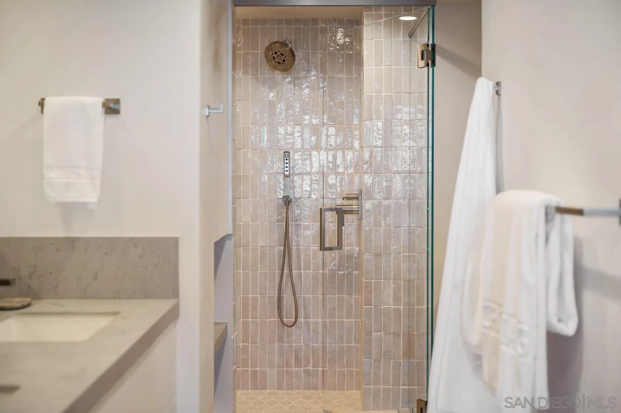 939 Coast Boulevard, Unit 12C La Jolla, CA 92037 - Photo 34 of 41 a bathroom with a sink and a shower