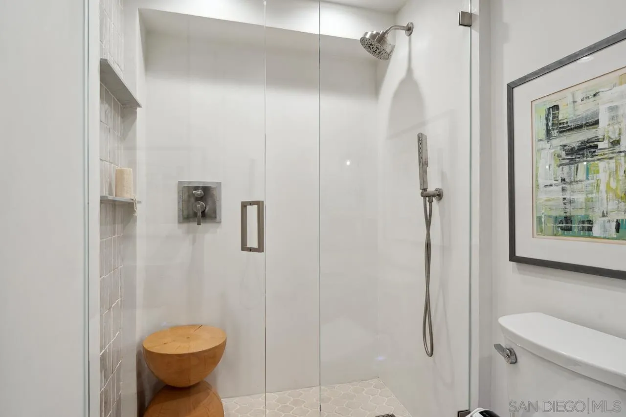 939 Coast Boulevard, Unit 12C La Jolla, CA 92037 - Photo 39 of 41 a bathroom with a shower and a toilet