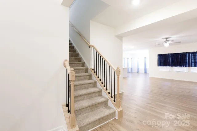 a view of an entryway with wooden floor