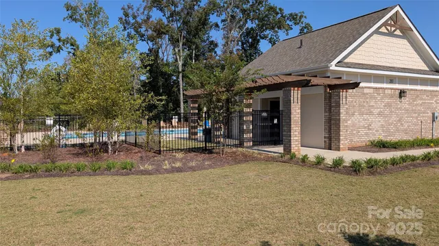 a view of a house with basketball court