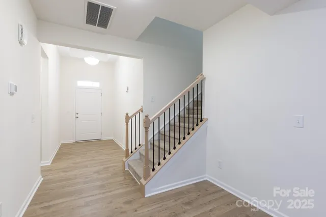 a view of a hallway with staircase