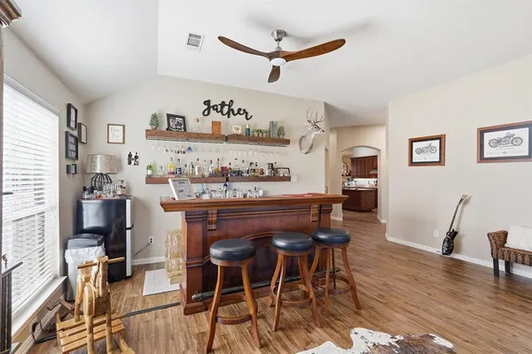 a living room with furniture fireplace and a flat screen tv