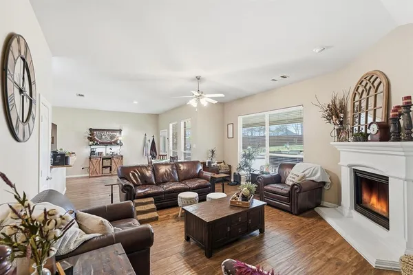 a living room with furniture a couch and a chandelier