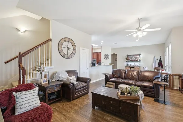 a spacious bedroom with a bed and flat screen tv